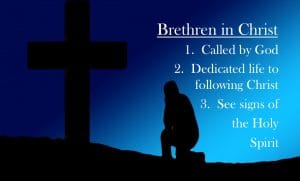 man-sitting-by-cross